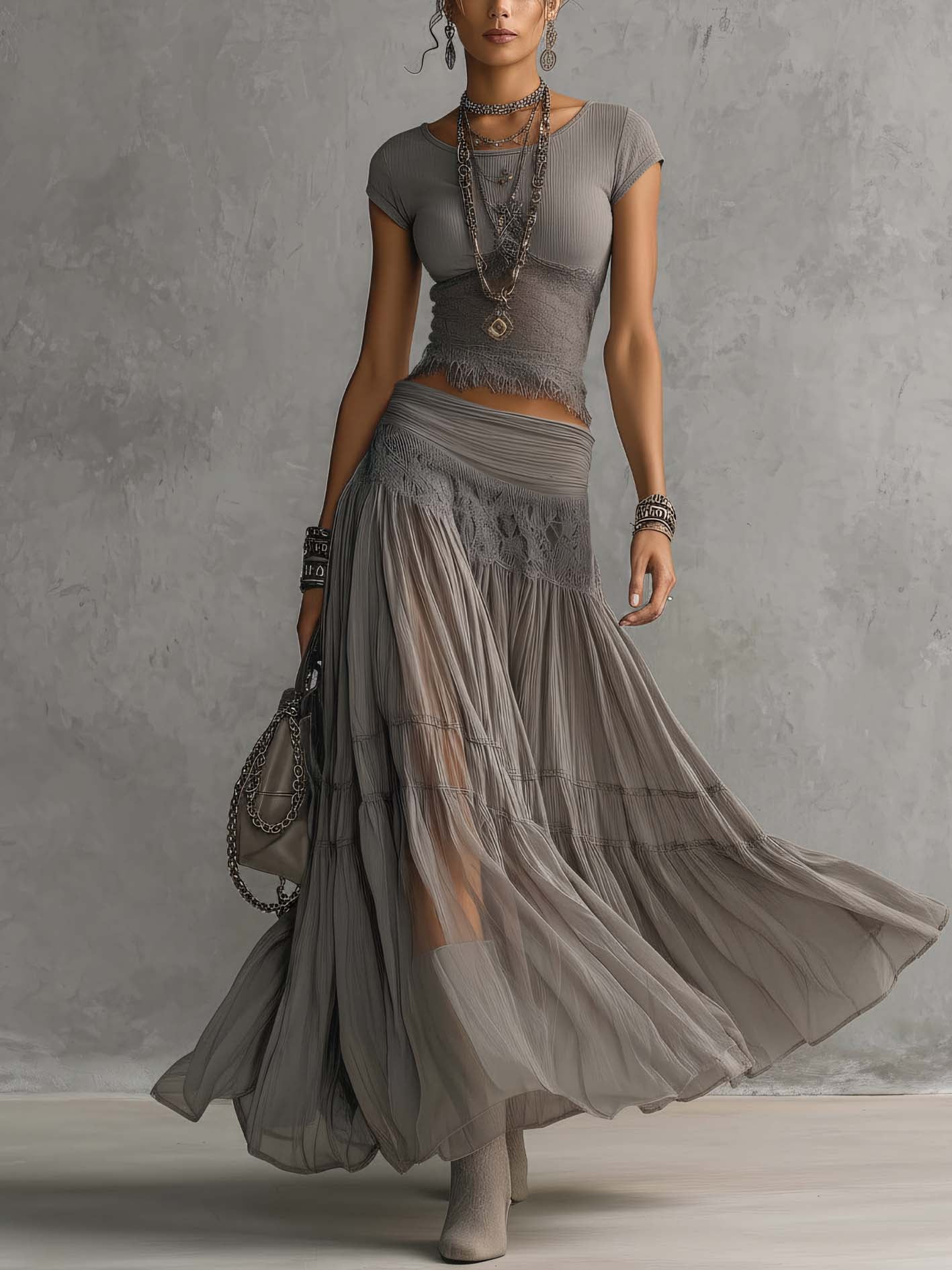 Ginevra · Set consisting of a sheer top with black lace panels and a pleated maxi skirt