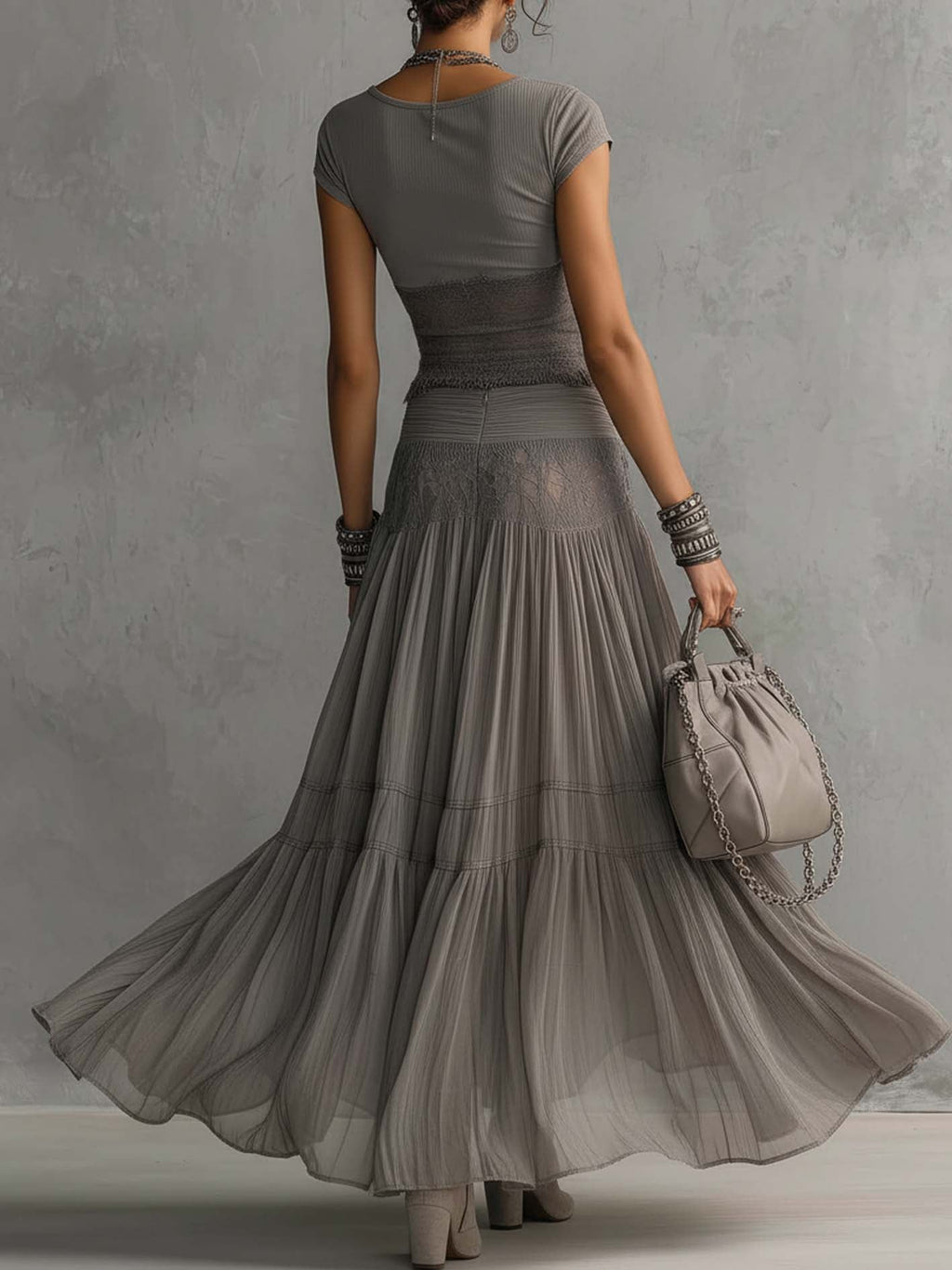 Ginevra · Set consisting of a sheer top with black lace panels and a pleated maxi skirt