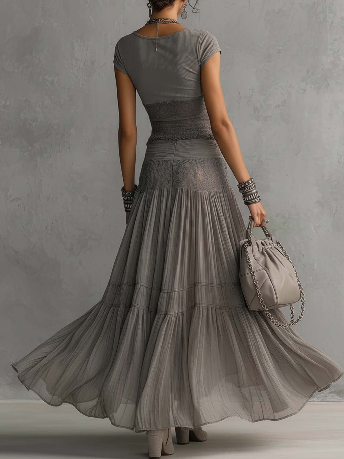 Ginevra · Set consisting of a sheer top with black lace panels and a pleated maxi skirt