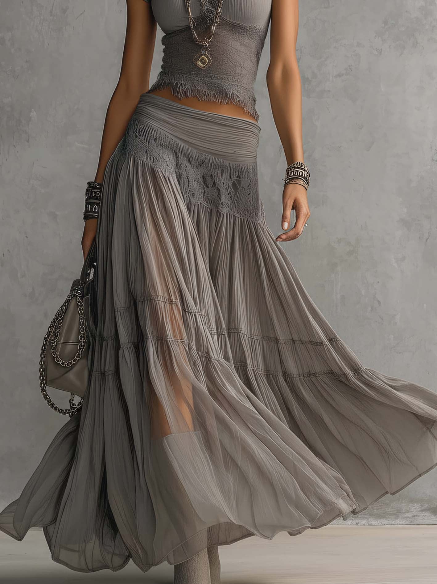 Ginevra · Set consisting of a sheer top with black lace panels and a pleated maxi skirt