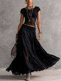 Ginevra · Set consisting of a sheer top with black lace panels and a pleated maxi skirt