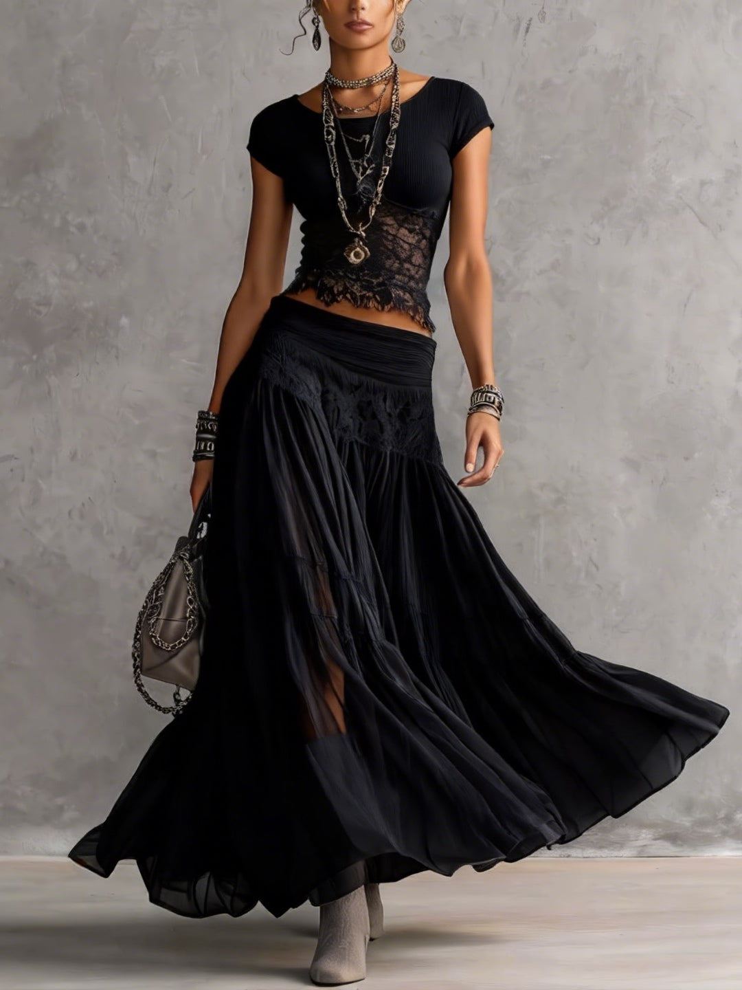 Ginevra · Set consisting of a sheer top with black lace panels and a pleated maxi skirt