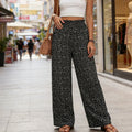 Women's high-waisted, smocked wide-leg pants