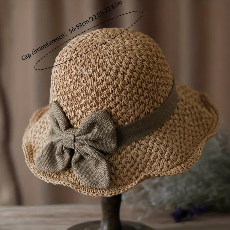 Elegant woven straw sun hat with a bow