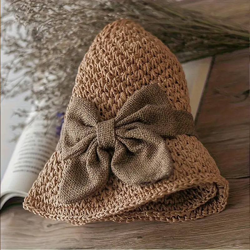 Elegant woven straw sun hat with a bow