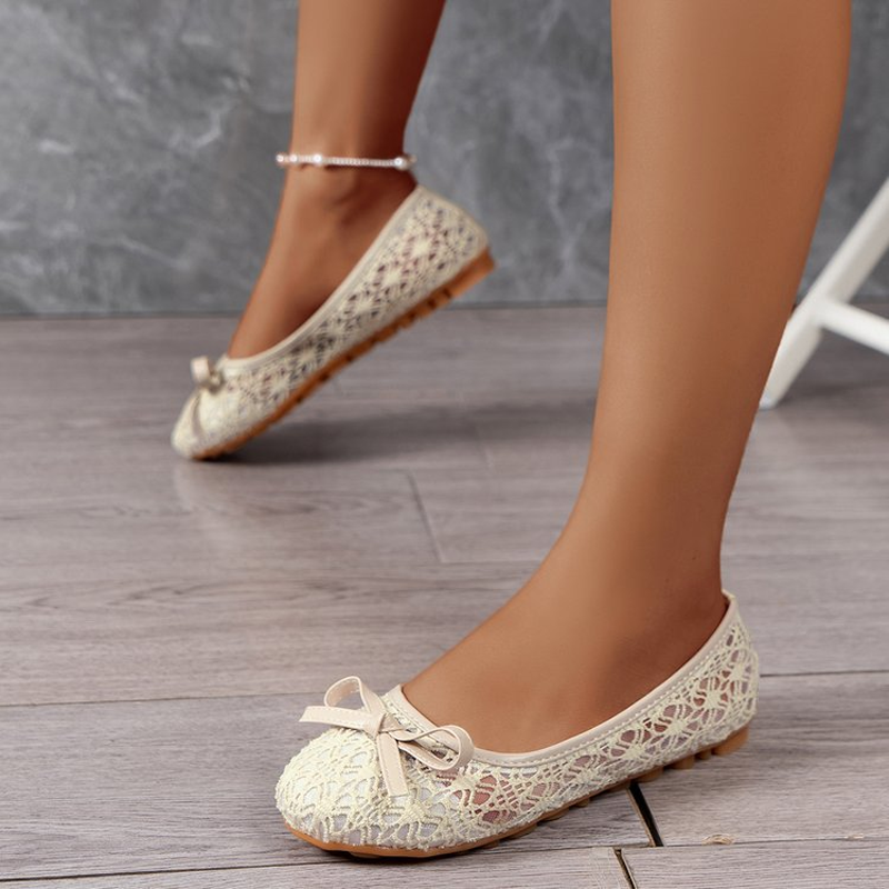 Elegant lace ballet flats for women, adorned with a bow