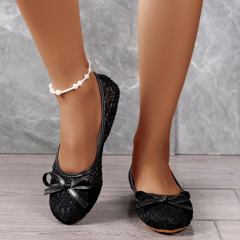 Elegant lace ballet flats for women, adorned with a bow