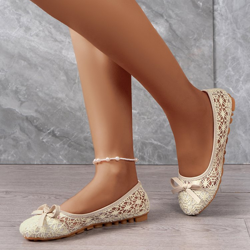 Elegant lace ballet flats for women, adorned with a bow