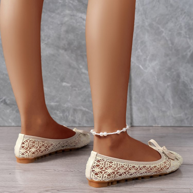 Elegant lace ballet flats for women, adorned with a bow